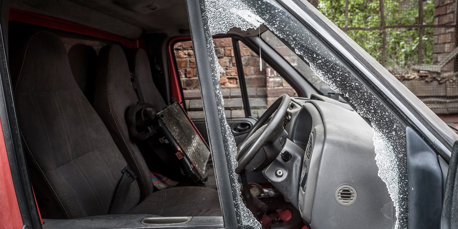 Damaged,Window,Pane,Of,A,Van,Cracked,By,Theft. Image of van that's been broken in to